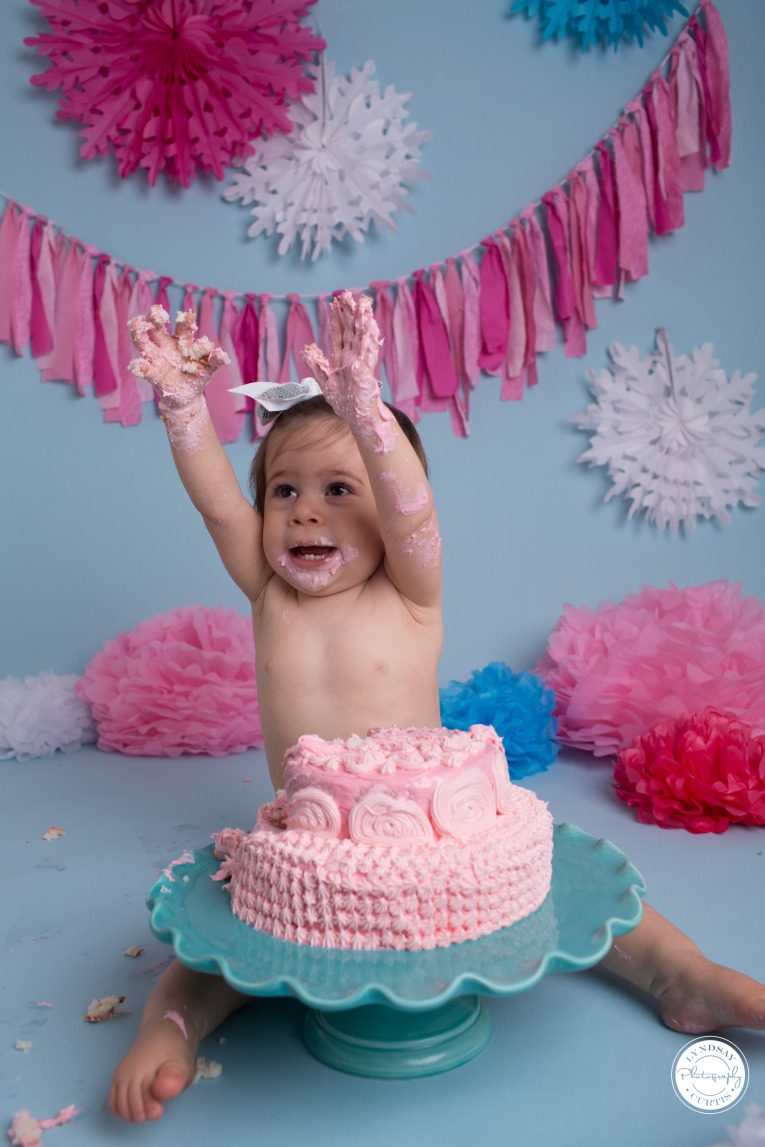 Portrait photographer Lyndsay Curtis photographs one year old Parker Smith at her blue and pink cake smash session in-studio in Sigonella | www.lyndsaycurtis.com