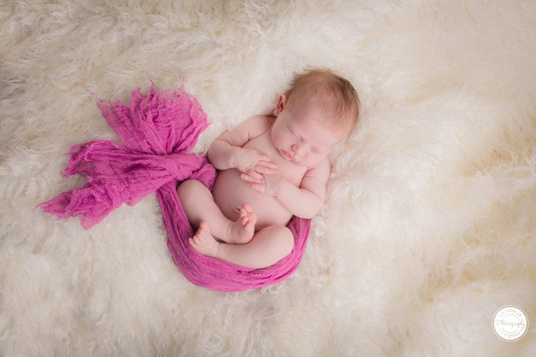 Portrait photographer Lyndsay Curtis photographs twelve day old baby Jacqueline in her in-home newborn studio. | www.lyndsaycurtis.com