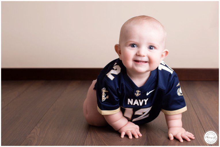 Portrait photographer Lyndsay Curtis photographs nine month old U.S. Navy baby James in her in-home photography studio. | www.lyndsaycurtis.com