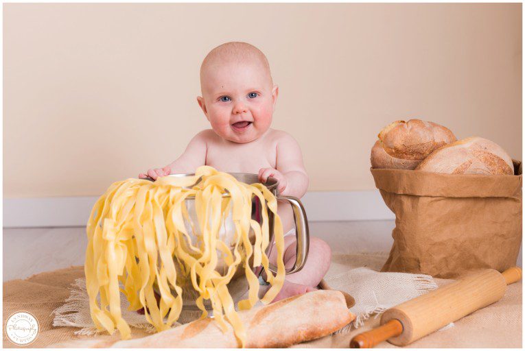 Portrait photographer Lyndsay Curtis photographs six month old Madi in her home studio with a baker and pasta baby set up. | www.lyndsaycurtis.com