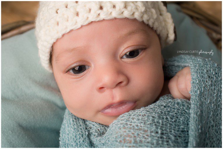 Portrait photographer Lyndsay Curtis photographs newborn girl in her in-home newborn studio. | www.lyndsaycurtis.com