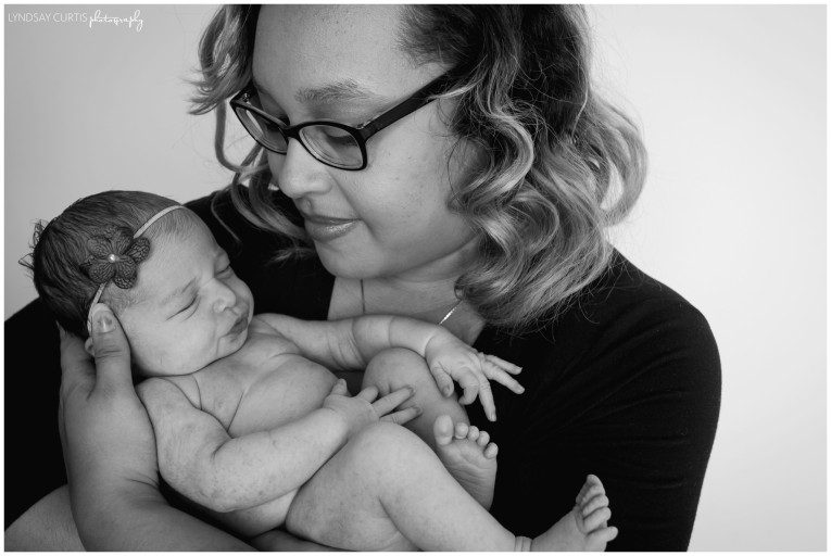 Portrait photographer Lyndsay Curtis photographs newborn girl in her in-home newborn studio. | www.lyndsaycurtis.comPortrait photographer Lyndsay Curtis photographs newborn girl with mom in her in-home newborn studio. | www.lyndsaycurtis.com