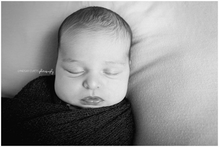 Portrait photographer Lyndsay Curtis photographs newborn girl in her in-home newborn studio. | www.lyndsaycurtis.com