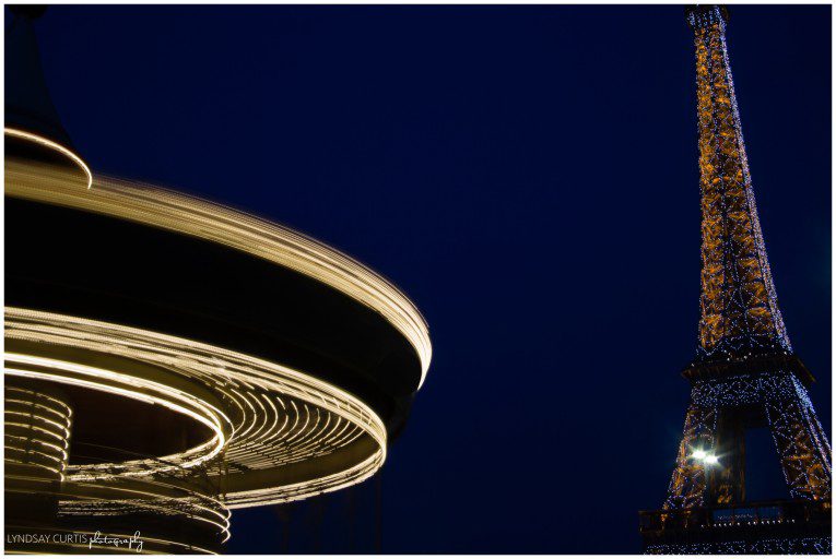 Travel photographer Lyndsay Curtis documents the Eiffel Tower and carousel in Paris, France at night. | www.lyndsaycurtis.com