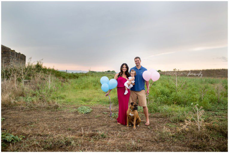 Portrait photographer Lyndsay Curtis photographs an outdoor gender reveal session for the pregnant Thomas family in Sigonella, Sicily. | www.lyndsaycurtis.com