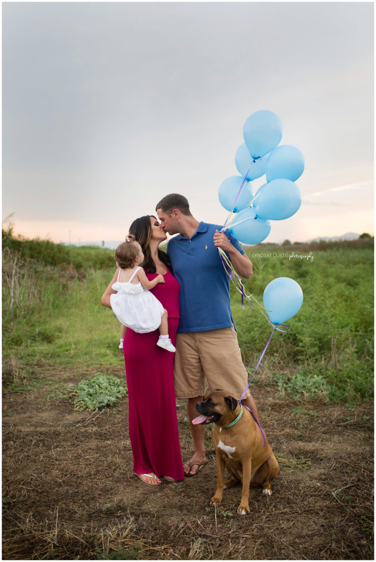 It's a boy! Portrait photographer Lyndsay Curtis photographs an outdoor gender reveal session for the pregnant Thomas family in Sigonella, Sicily. | www.lyndsaycurtis.com